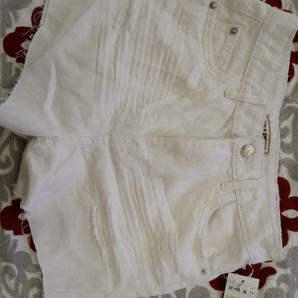 White ripped jean shorts